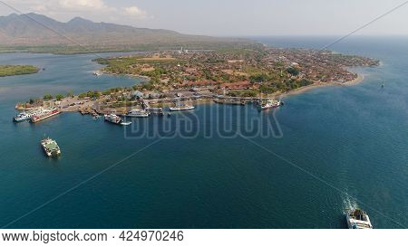 Aerial View Ferry Port Gilimanuk With Ferry Boats, Vehicles. Ferries Transport Vehicles And Passenge