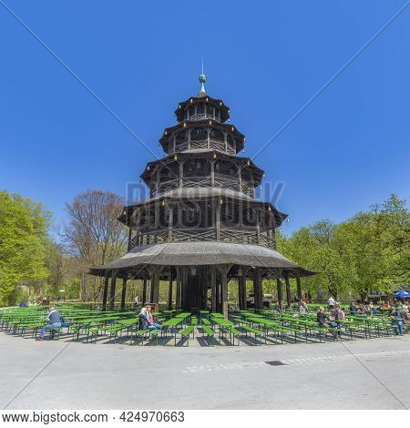Munich, Germany - April 20, 2015: : People Enjoy The  Biergarten Near Chinese Tower In English Garde