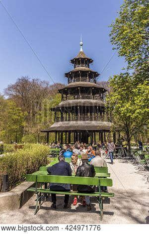 Munich, Germany - April 20, 2015: People Enjoy The  Biergarten Near Chinese Tower In English Garden 