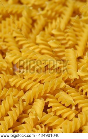 Close Up Of Dry Uncooked Yllow Fusilli