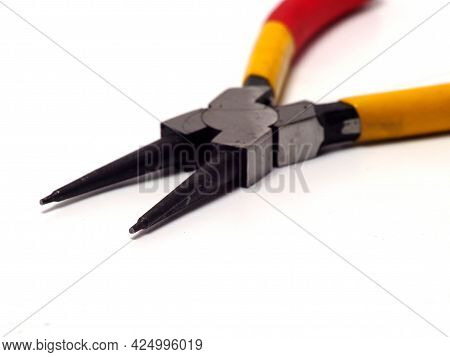 Picture Of Snap Ring Plier That Has A Yellow - Red Handle