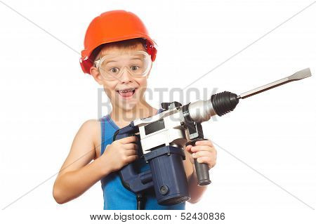 little boy in a helmet with electric hammer