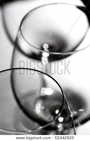 Red wine glasses go to blur in black and white