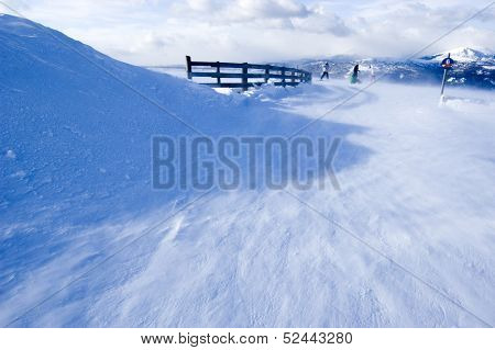 snow covered Alps with some skiers