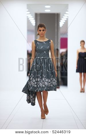 ZAGREB, CROATIA - OCTOBER 12: Fashion model in cocktail dress made by Lorien on 'Wedding Expo' show in the Westgate Shopping City in Zagreb, Croatia on October 12, 2013