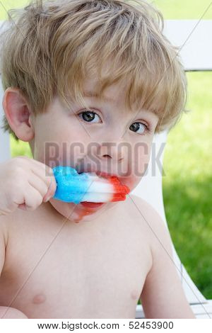 Toddler eating a popsicle
