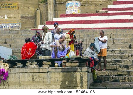 Hindu People Wash Themselves In The River Ganga In The Holy City Of Varanasi