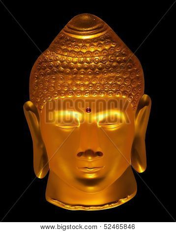 Close up face of Golden Buddha isolated black