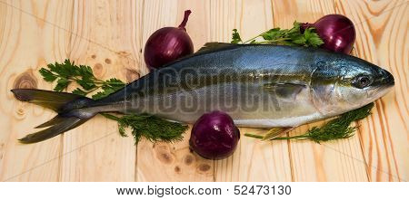 Whole Round Fish Yellowtail And Three Red Onions