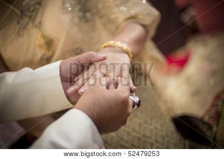 Marry Me. Groom Put A Ring On Finger Of His Lovely Wife