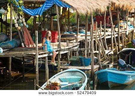 Urban teengirl in a fishing village.