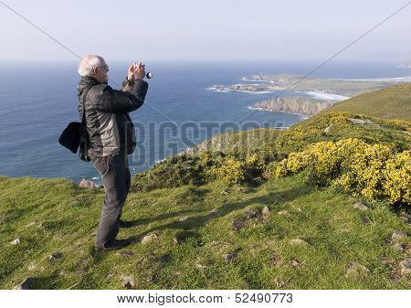 Man Photographing A Landscape
