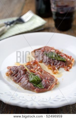 Saltimbocca alla Romana on a rustic table