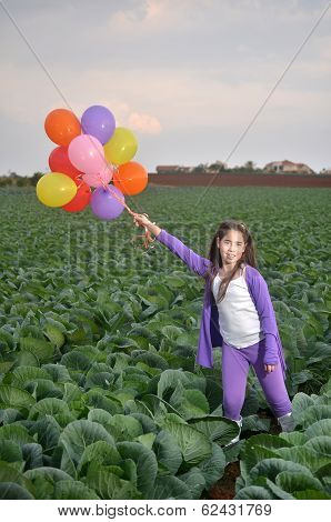 A Teenage Girl In Purple With Colorful Balloons