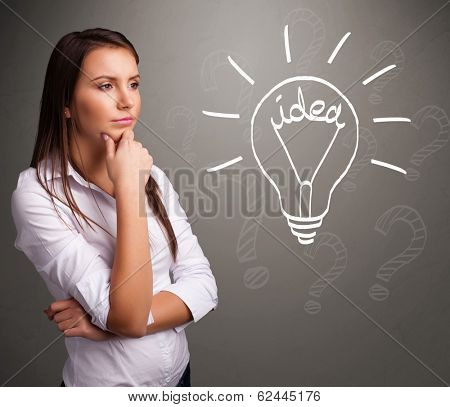 Pretty young girl comming up with a light bubl idea sign
