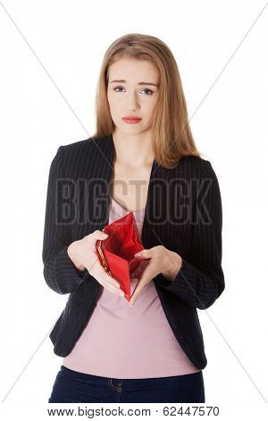 Business woman is showing her empty wallet. Isolated on white.
