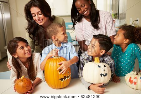 Mothers And Children Making Halloween Lanterns