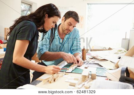Two Architects Making Models In Office Together