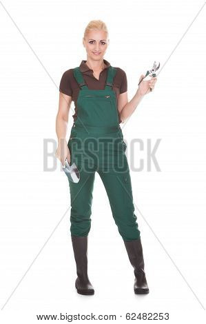 Portrait Of A Female Worker Holding Worktool