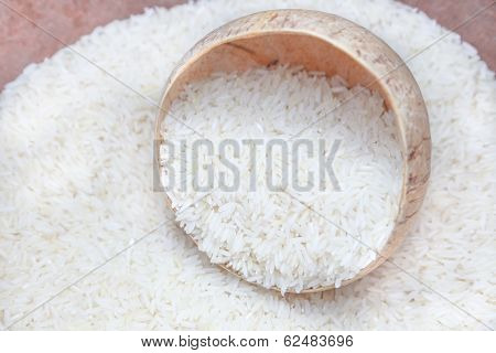 Uncooked Rice In Coconut Shell Bowl