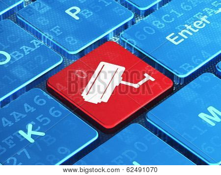 Privacy concept: Cctv Camera on computer keyboard background