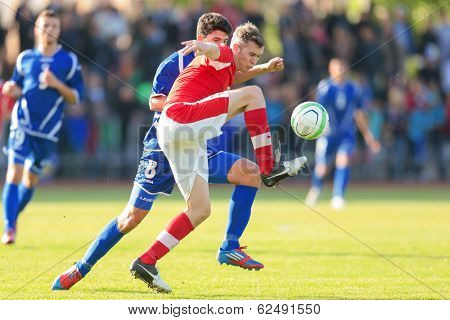 TRAISKIRCHEN, AUSTRIA - JUNE 5 Lukas Jaeger (#3 Austria) and Mirko Maric (#8 Bosnia and Herzegovina) fight for the ball during the U19 game on June 5, 2013 in Traiskirchen, Austria.