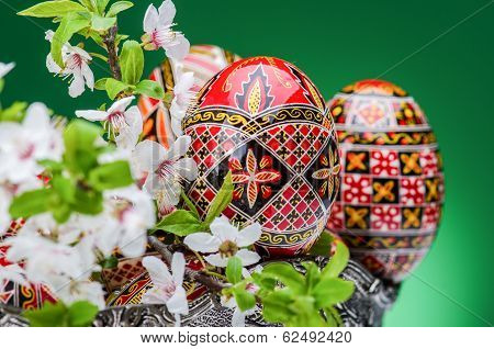 Beautiful red easter egg against green gackground