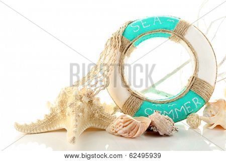 Lifebuoy and sea shells, isolated on white