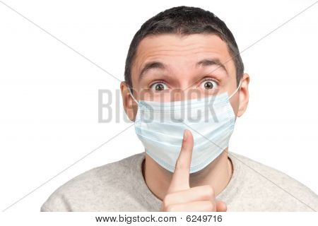Skræmt mand stilhed tegn i beskyttende maske