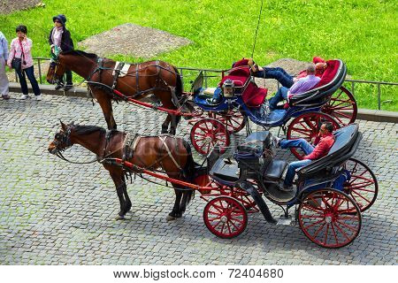 Coachmen Sitting On Chairs, Pulled By A Horse, Waiting For Tourists To The Area Near The Colosseum I