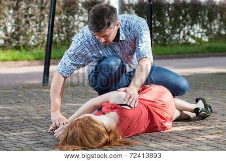 Man Lying Girl In Recovery Position