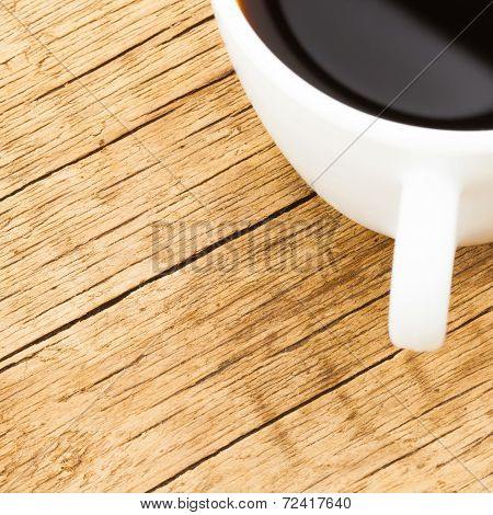 White Ceramic Coffee Cup On Old Wooden Table - View From Top