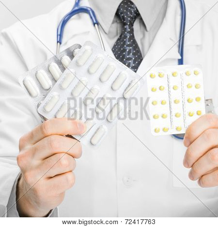 Doctor Holdling Pills In His Hands - Heath Care Concept