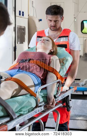 Senseless Girl Lying On Stretcher