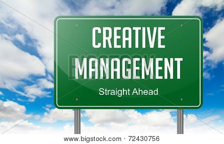 Creative Management on Highway Signpost.