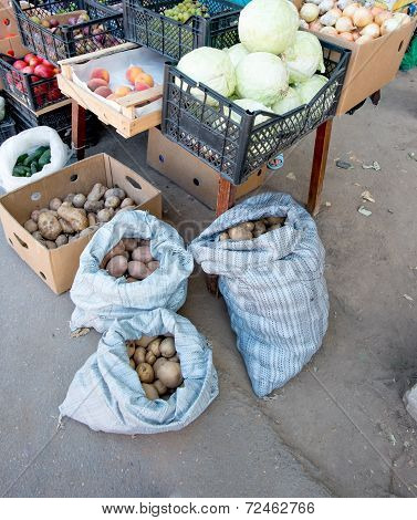 Potatoes in bags, fruit and vegetables stall in Russia