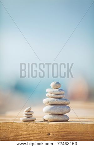 zen stones jy wooden banch on the beach near sea. Outdoor