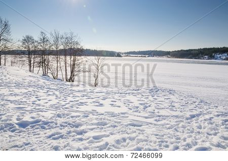 Snowy Landscape By Lake