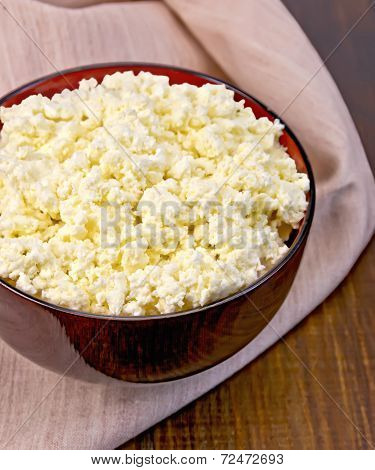 Curd In Wooden Bowl With Napkin On Board