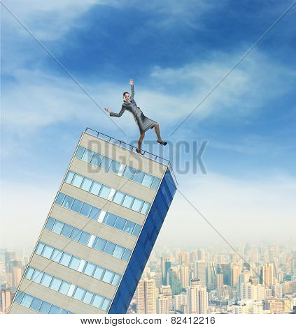 Businesswoman on the falling builging