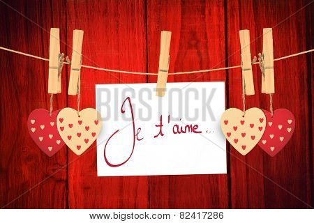 Valentines love hearts against red wooden planks