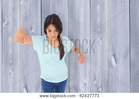 Powerless brunette against wooden planks