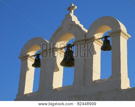 Three bells and cross on top of chapel on Comino, Malta