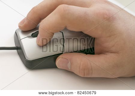 A Hand Using A Computer Mouse