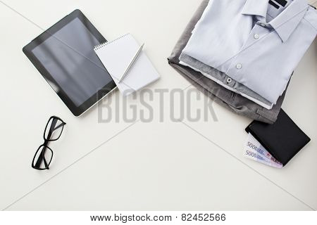business, style, clothes and objects concept - close up of formal male clothes and personal stuff on table at home