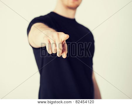 close up of man pointing his finger at you