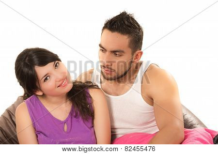 sweet latin couple hugging wearing their pijamas