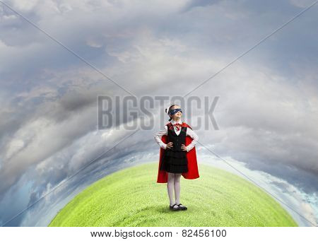 Girl of school age in super hero costume