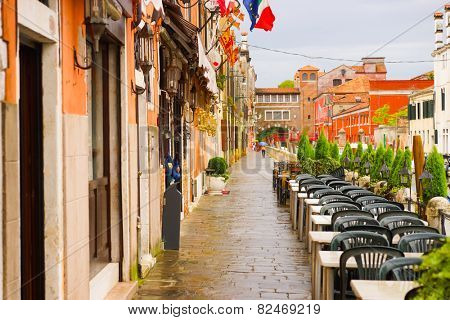 VENICE - SEP 12: Venice street on September 12, 2014 in Venice, Italy. Venice is a city in northeastern Italy sited on a group of 118 small islands separated by canals and linked by bridges