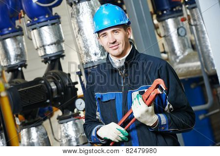 industrial construction worker plumber  at boiler room